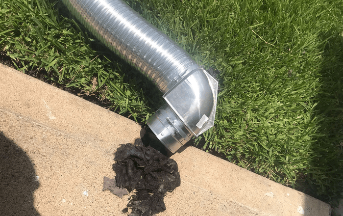 Sidewall or rooftop dryer vent deep cleaning in North Carolina removing heavy lint buildup